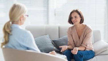 Image of women talking in therapy session
